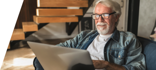 image of relaxed man looking at a laptop